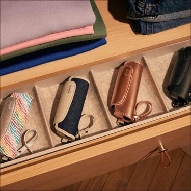 Ploom Aura Multicolored Patterned Canvas Solo Carry Case accessory on a table