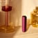 ploom-aura-dark-orchid-device-standing-table