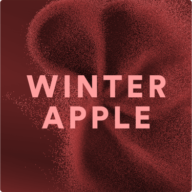 Visual astratto Winter Apple con particelle rosse e lettering centrale.